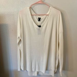 Cream long sleeve top.